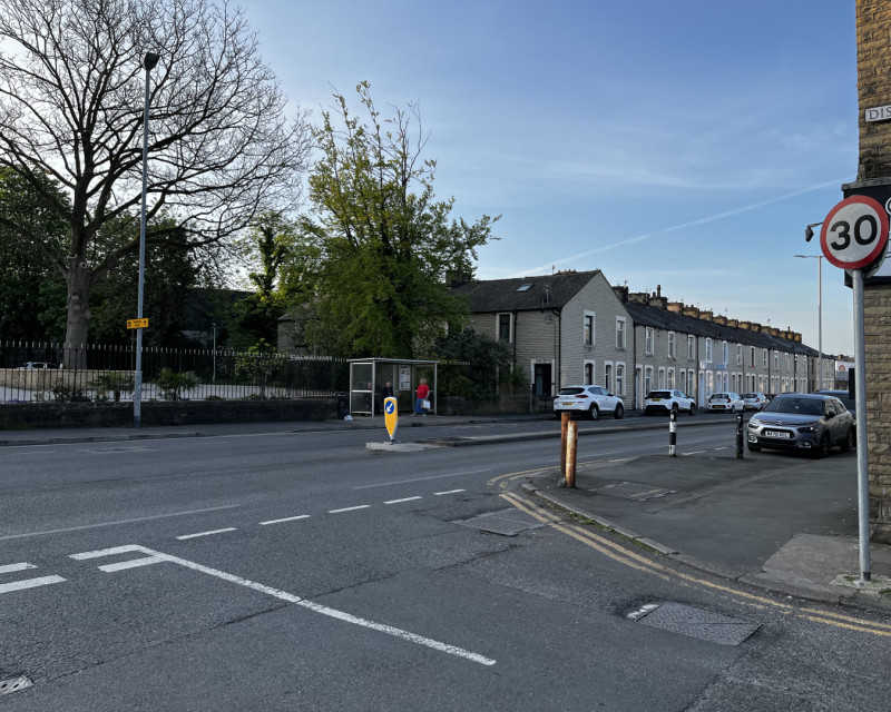 Waiting for the supporters coach at Queensgate bus depot in Burnley, on a sunny morning.