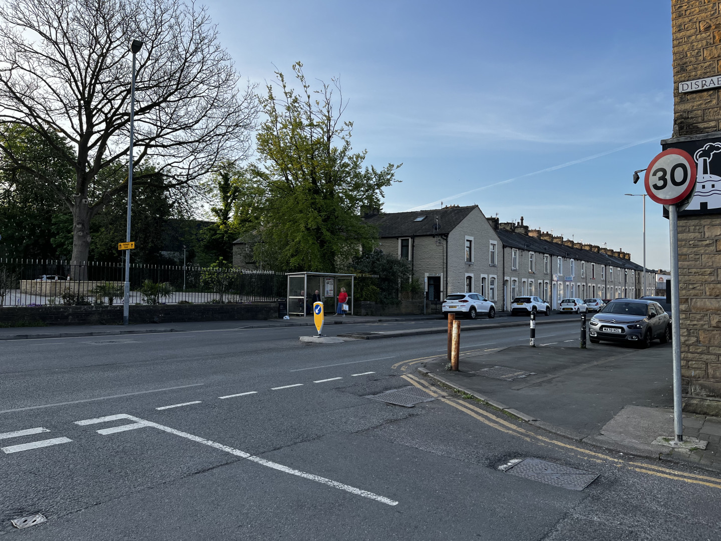 Waiting for the supporters coach at Queensgate bus depot in Burnley, on a sunny morning.