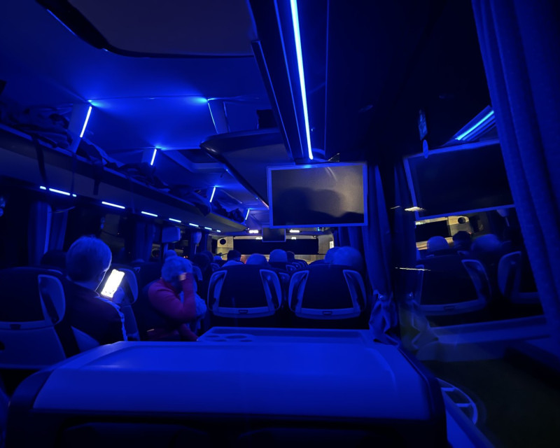 Internal view of a coach, travelling on the motorway, at night