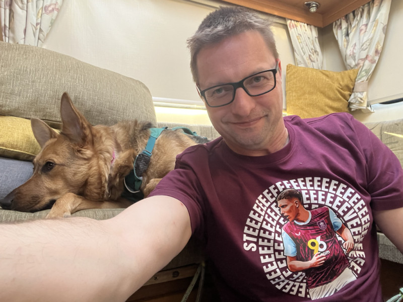 Picture of Caoimhe and myself sat in our van, I'm wearing a Maxime Esteve tee shirt, Caoimhe is not