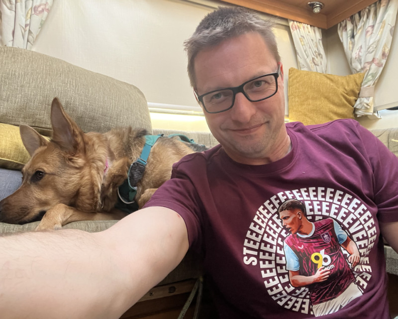 Picture of Caoimhe and myself sat in our van, I'm wearing a Maxime Esteve tee shirt, Caoimhe is not