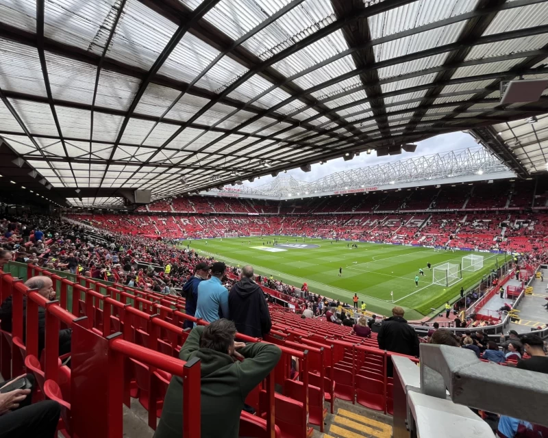 Picture looking diagonally across the pitch at Old Trafford as the stadium begins to fill ahead of kick off